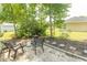 This cozy backyard patio features outdoor seating, a grill, and pea gravel, creating a relaxing outdoor space at 6610 Mallard View Point, Myrtle Beach, SC 29588