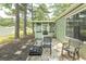 This backyard features a screened porch, outdoor seating and a grill, making it a relaxing outdoor space at 6610 Mallard View Point, Myrtle Beach, SC 29588