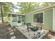 This backyard features a screened porch, outdoor seating and a grill, making it a relaxing outdoor space at 6610 Mallard View Point, Myrtle Beach, SC 29588