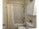 The bathroom featuring a toilet, bathtub/shower combo, and a white storage cabinet at 6610 Mallard View Point, Myrtle Beach, SC 29588