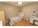Cozy bedroom features hardwood floors, comfortable bed, and a vanity area at 6610 Mallard View Point, Myrtle Beach, SC 29588