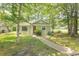 Charming single-story home with a well-maintained lawn, mature trees, and a welcoming walkway at 6610 Mallard View Point, Myrtle Beach, SC 29588