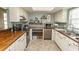 Cozy kitchen featuring stone floors, butcher block countertops, and lots of counter space at 6610 Mallard View Point, Myrtle Beach, SC 29588