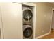 Convenient laundry area with stacked washer and dryer units for efficient space saving at 6610 Mallard View Point, Myrtle Beach, SC 29588