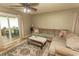 Inviting living room featuring a plush sofa, hardwood floors, and an open patio entrance at 6610 Mallard View Point, Myrtle Beach, SC 29588