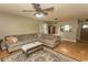 Bright living room features hardwood floors, a comfortable sofa, and natural light at 6610 Mallard View Point, Myrtle Beach, SC 29588
