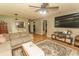 Spacious living room with hardwood floors, a comfortable sofa, and a breakfast bar at 6610 Mallard View Point, Myrtle Beach, SC 29588