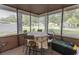 Enclosed sunroom with plenty of natural light, seating and neighborhood views at 6610 Mallard View Point, Myrtle Beach, SC 29588