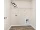 Functional laundry area with essential hookups, shelving, and stylish décor for added convenience at 664 Culmen Ct., Myrtle Beach, SC 29588
