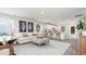 Open living space featuring a modern kitchen, comfortable seating, and wood-look flooring at 664 Culmen Ct., Myrtle Beach, SC 29588