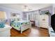 Inviting bedroom features wood floors, cottage decor and a large window at 705 11Th Ave. S, North Myrtle Beach, SC 29582