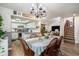 Open concept dining area with wood floors that seamlessly connects to the kitchen and living spaces at 705 11Th Ave. S, North Myrtle Beach, SC 29582