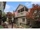 Charming home featuring a covered balcony, beautiful landscaping, and an American flag at 705 11Th Ave. S, North Myrtle Beach, SC 29582