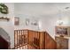 Bright hallway with wooden railing offers views of the living room and natural light at 705 11Th Ave. S, North Myrtle Beach, SC 29582
