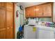 Functional laundry room with washer, dryer, storage cabinets and essentials at 705 11Th Ave. S, North Myrtle Beach, SC 29582