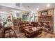 Comfortable living room featuring a brick fireplace, wood floors, and cozy seating at 705 11Th Ave. S, North Myrtle Beach, SC 29582