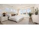 Stylish main bedroom with large windows and neutral tones, creating a relaxing and bright space at 716 Rupert Dr, Conway, SC 29526