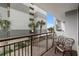 Balcony with patio seating and a view of the nearby building and a glimpse of the beach at 7200 N Ocean Blvd. # 260, Myrtle Beach, SC 29572
