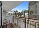 Balcony with seating overlooking palm trees with an ocean view at 7200 N Ocean Blvd. # 260, Myrtle Beach, SC 29572