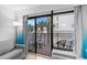 Comfortable balcony seating area with an ocean view through swaying palm trees at 7200 N Ocean Blvd. # 260, Myrtle Beach, SC 29572