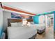 Comfortable bedroom with two beds, bright decor, and a sliding barn door at 7200 N Ocean Blvd. # 260, Myrtle Beach, SC 29572