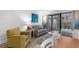 Cozy living area offers comfortable seating and balcony access with outdoor views at 7200 N Ocean Blvd. # 260, Myrtle Beach, SC 29572