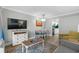 Open living area with television, dining space, and modern finishes for comfort at 7200 N Ocean Blvd. # 260, Myrtle Beach, SC 29572