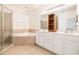 Bathroom with double vanity, walk-in shower, large tub, and neutral tile flooring at 730 Pickering Dr. # 303, Murrells Inlet, SC 29576