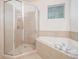 Bathroom features a walk-in shower, soaking tub, and a tiled shower at 730 Pickering Dr. # 303, Murrells Inlet, SC 29576