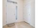 Bright entryway features tiled floors, a transom window, and white doors at 730 Pickering Dr. # 303, Murrells Inlet, SC 29576