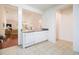 Kitchen with white cabinets, dishwasher, and view into an adjacent living space at 730 Pickering Dr. # 303, Murrells Inlet, SC 29576