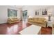 Bright living room featuring hardwood floors, neutral decor, and sliding glass door at 730 Pickering Dr. # 303, Murrells Inlet, SC 29576