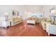Bright living room featuring hardwood floors, neutral decor, and an open layout at 730 Pickering Dr. # 303, Murrells Inlet, SC 29576