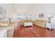 Spacious living room flows into the kitchen, with hardwood floors and natural light at 730 Pickering Dr. # 303, Murrells Inlet, SC 29576
