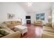 Cozy living room boasts a fireplace, vaulted ceiling, and comfortable seating at 730 Pickering Dr. # 303, Murrells Inlet, SC 29576