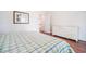 Cozy main bedroom showcases hardwood floors and a view into an adjacent hallway at 730 Pickering Dr. # 303, Murrells Inlet, SC 29576