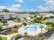 An inviting community pool area featuring palm trees, lounge chairs, and a playground offers a relaxing retreat at 730 Pickering Dr. # 303, Murrells Inlet, SC 29576