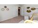 Bright Bedroom space with stylish decorations and open doorway leading to a bathroom at 739 Chazen Way, Longs, SC 29568