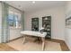 Bright office space featuring a decorative desk, stylish bookshelves, and ample natural light from the window at 739 Chazen Way, Longs, SC 29568