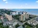 Aerial view shows the coastal location with a building marked by a pin near the beach and ocean at 7500 N Ocean Blvd. # 6122, Myrtle Beach, SC 29572