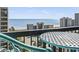 Balcony view showcasing the ocean and outdoor seating with metal table at 7500 N Ocean Blvd. # 6122, Myrtle Beach, SC 29572