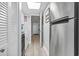 The cozy kitchen features a stainless steel refrigerator and connects to the hallway at 7500 N Ocean Blvd. # 6122, Myrtle Beach, SC 29572