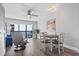 Cozy condo interior with dining table and ocean view from large glass door at 7500 N Ocean Blvd. # 6122, Myrtle Beach, SC 29572