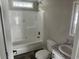Bathroom featuring a bathtub with shower, a sink, a toilet, and granite countertops at 800 Columbia Dr., Myrtle Beach, SC 29577