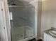 Modern bathroom featuring a glass-enclosed shower with marble-patterned tile and a vanity at 800 Columbia Dr., Myrtle Beach, SC 29577