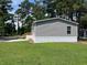 Side view of charming single-story home with gray siding and white trim at 800 Columbia Dr., Myrtle Beach, SC 29577