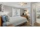 Comfortable bedroom with a queen bed, dresser, and a view of the outdoors at 824 N Waccamaw Dr. # 203, Murrells Inlet, SC 29576