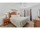 Comfortable bedroom with a ceiling fan and natural light at 824 N Waccamaw Dr. # 203, Murrells Inlet, SC 29576