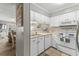 Functional kitchen with white cabinetry and essential appliances at 824 N Waccamaw Dr. # 203, Murrells Inlet, SC 29576