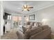 Living room features carpeting, slider door access to balcony, neutral decor and comfortable seating at 824 N Waccamaw Dr. # 203, Murrells Inlet, SC 29576